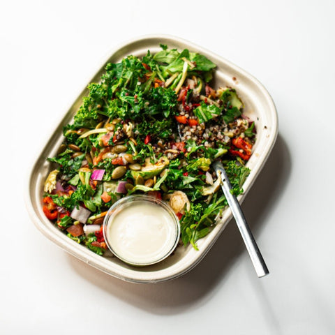 Tabbouleh crunch salad with quinoa, shredded broccoli, cabbage, carrot, radicchio, tomato, red pepper, cucumber, arugula, and lemon tahini dressing.